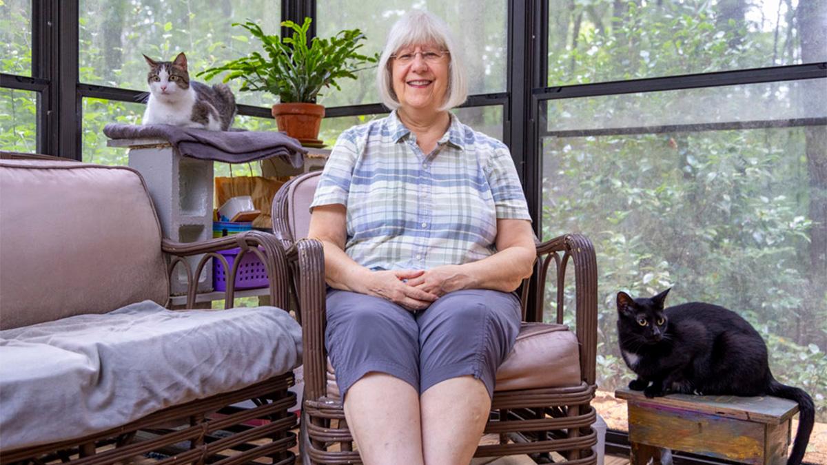 Patricia Sawin with her two cats.